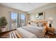 Bright bedroom featuring two windows, hardwood floors, and a comfortable queen size bed at 975 N Lincoln St # 10A, Denver, CO 80203