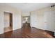 Bright bedroom features hardwood floors, closet and adjacent bathroom with tile floors at 975 N Lincoln St # 10A, Denver, CO 80203