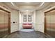 A stylish elevator lobby with seating, decorated walls and access to dual elevators at 975 N Lincoln St # 10A, Denver, CO 80203