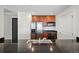 Kitchen featuring stainless appliances, granite countertops, and rich wood cabinets at 975 N Lincoln St # 10A, Denver, CO 80203