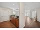 A modern kitchenette with stainless steel appliances, sleek countertops, and dark cabinets at 975 N Lincoln St # 10A, Denver, CO 80203