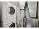 Small laundry room with stacked washer and dryer, and updated HVAC system at 975 N Lincoln St # 10A, Denver, CO 80203