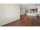 Hardwood floors throughout living room with kitchen featuring stainless steel appliances at 975 N Lincoln St # 10A, Denver, CO 80203