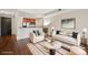 Bright living room with modern decor, open to kitchen featuring stainless steel appliances at 975 N Lincoln St # 10A, Denver, CO 80203