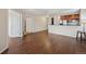 An inviting living area with hardwood flooring, open space and a doorway to the bedroom at 975 N Lincoln St # 10A, Denver, CO 80203