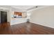 Open concept living room featuring hardwood floors and a kitchen bar area at 975 N Lincoln St # 10A, Denver, CO 80203