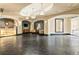 A luxurious lobby with high ceilings, chandelier lighting, stone floors, and an attended reception desk at 975 N Lincoln St # 10A, Denver, CO 80203