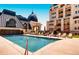 Rooftop swimming pool, lounge chairs, pool house and building in the background at 975 N Lincoln St # 10A, Denver, CO 80203