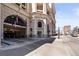Street view of a building with an open parking garage and number 975 on its facade at 975 N Lincoln St # 10A, Denver, CO 80203