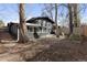 Spacious backyard with mature trees offers ample outdoor space for recreation and relaxation at 1345 S Ivy Way, Denver, CO 80224