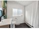 Bathroom featuring a modern vanity, updated fixtures, and shower with curtain at 1345 S Ivy Way, Denver, CO 80224
