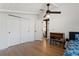 Bedroom with hardwood flooring, ceiling fan, and closet at 1345 S Ivy Way, Denver, CO 80224