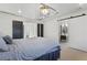 Bright bedroom with a modern bed, stylish lighting, and a view into the bathroom, offering a comfortable retreat at 1345 S Ivy Way, Denver, CO 80224