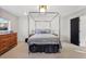 Serene bedroom with a modern canopy bed, stylish decor, and ample natural light, creating a cozy and inviting space at 1345 S Ivy Way, Denver, CO 80224