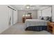 Inviting bedroom featuring neutral tones, soft carpeting, and a canopy bed, creating a serene and relaxing atmosphere at 1345 S Ivy Way, Denver, CO 80224