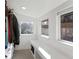 Bright walk-in closet with custom shelving, storage solutions, and natural light, providing ample space for organization at 1345 S Ivy Way, Denver, CO 80224