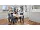Bright dining room with modern table and chairs, offering a comfortable dining space at 1345 S Ivy Way, Denver, CO 80224