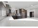 Updated kitchen featuring dark cabinets, stainless steel appliances, and elegant countertops, great natural light from windows at 1345 S Ivy Way, Denver, CO 80224