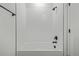 Modern bathroom features a sleek white tiled shower and matte black fixtures at 20530 E 58Th Ave, Aurora, CO 80019
