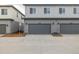 Modern townhome garage with attached garages and coordinated design at 20530 E 58Th Ave, Aurora, CO 80019
