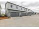 Exterior view of townhome garages in a neatly maintained community at 20530 E 58Th Ave, Aurora, CO 80019