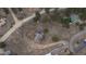 Aerial view of the property showcasing a fenced yard, solar panels, and driveway access at 28364 Tresine Dr, Evergreen, CO 80439