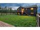 Expansive backyard with a well-maintained lawn and a deck offers space for outdoor living at 28364 Tresine Dr, Evergreen, CO 80439