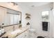 Bathroom with granite countertop, stylish mirror, and well-organized towel rack at 28364 Tresine Dr, Evergreen, CO 80439