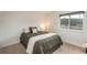 Cozy bedroom with a comfortable bed, soft pillows, and a window offering pleasant outdoor views at 28364 Tresine Dr, Evergreen, CO 80439