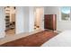 Bright bedroom with a walk-in closet, dresser, and view to an en-suite bath at 28364 Tresine Dr, Evergreen, CO 80439