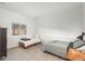 Bright bedroom featuring two twin beds, light grey carpet, and a window with a view to the outdoors at 28364 Tresine Dr, Evergreen, CO 80439