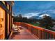 Spacious deck offers stunning views and cozy seating, perfect for relaxing and entertaining at 28364 Tresine Dr, Evergreen, CO 80439