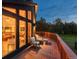 From deck you can see the living room with furniture, and the great outdoor view with lots of trees at 28364 Tresine Dr, Evergreen, CO 80439