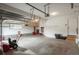 Spacious garage featuring ample storage, work benches, and room for parking and projects at 28364 Tresine Dr, Evergreen, CO 80439