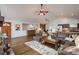 Inviting living room with an open floor plan, a modern fireplace, and stylish decor at 28364 Tresine Dr, Evergreen, CO 80439