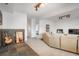Open-concept living room features comfortable seating, tiled accent wall, and decor at 28364 Tresine Dr, Evergreen, CO 80439