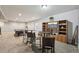 Spacious basement with a billiards table, bar seating, and entertainment center at 11346 E 27Th Ave, Denver, CO 80238