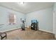 Basement gym area with carpet flooring, exercise equipment, and natural light at 11346 E 27Th Ave, Denver, CO 80238