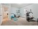 Basement workout area featuring exercise equipment and neutral paint colors at 11346 E 27Th Ave, Denver, CO 80238