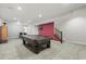 Large basement game room equipped with a pool table and ping pong at 11346 E 27Th Ave, Denver, CO 80238
