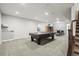 Spacious basement featuring a pool table, bar seating and entertainment area perfect for hosting gatherings at 11346 E 27Th Ave, Denver, CO 80238