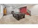 Finished basement featuring a billiards table and carpeted floors for added comfort at 11346 E 27Th Ave, Denver, CO 80238