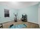 Finished basement with workout equipment and carpeted flooring, perfect for fitness at 11346 E 27Th Ave, Denver, CO 80238