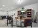 Finished basement area features a pool table, TV, and bar table setup at 11346 E 27Th Ave, Denver, CO 80238