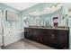 Luxurious bathroom with double vanity, soaking tub, and elegant fixtures at 11346 E 27Th Ave, Denver, CO 80238
