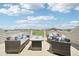 Spacious outdoor deck with comfortable patio furniture and neighborhood views at 11346 E 27Th Ave, Denver, CO 80238