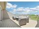 Outdoor deck with wicker seating and views of the surrounding neighborhood at 11346 E 27Th Ave, Denver, CO 80238