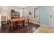 Traditional dining room features hardwood floors, bright windows, and a classic dining set at 11346 E 27Th Ave, Denver, CO 80238