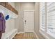 Cozy entryway with built-in storage, bench, and window, creating a practical and welcoming space at 11346 E 27Th Ave, Denver, CO 80238