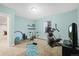 Bright exercise room with workout equipment, shelves and blue walls, ideal for staying active at home at 11346 E 27Th Ave, Denver, CO 80238